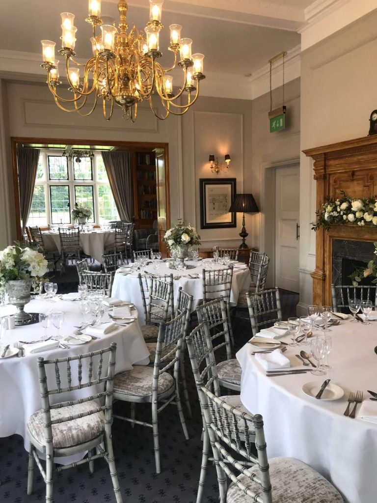 Elegant dining setup for an anniversary celebration in the Library Suite at Greenwoods Hotel in Essex