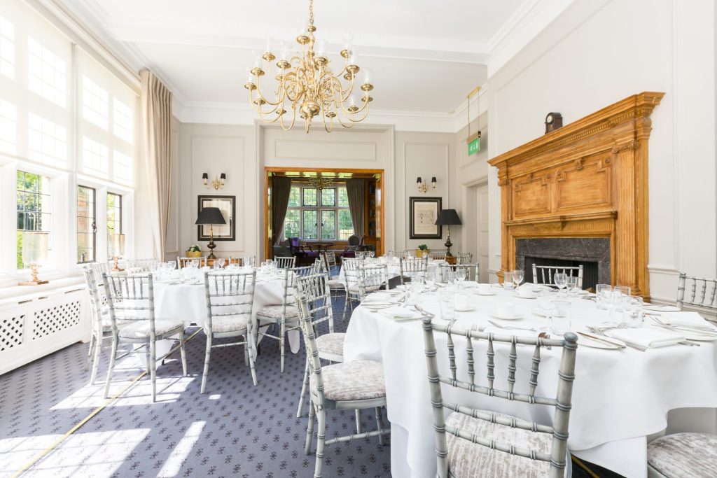 Three round tables arranged for a birthday party or special occasion in the Library Suite at Greenwoods Hotel