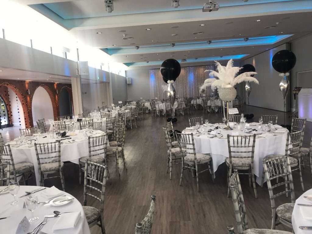 Elegant white feather centrepiece tables for a charity ball in the Garden Suite at Greenwoods Hotel.
