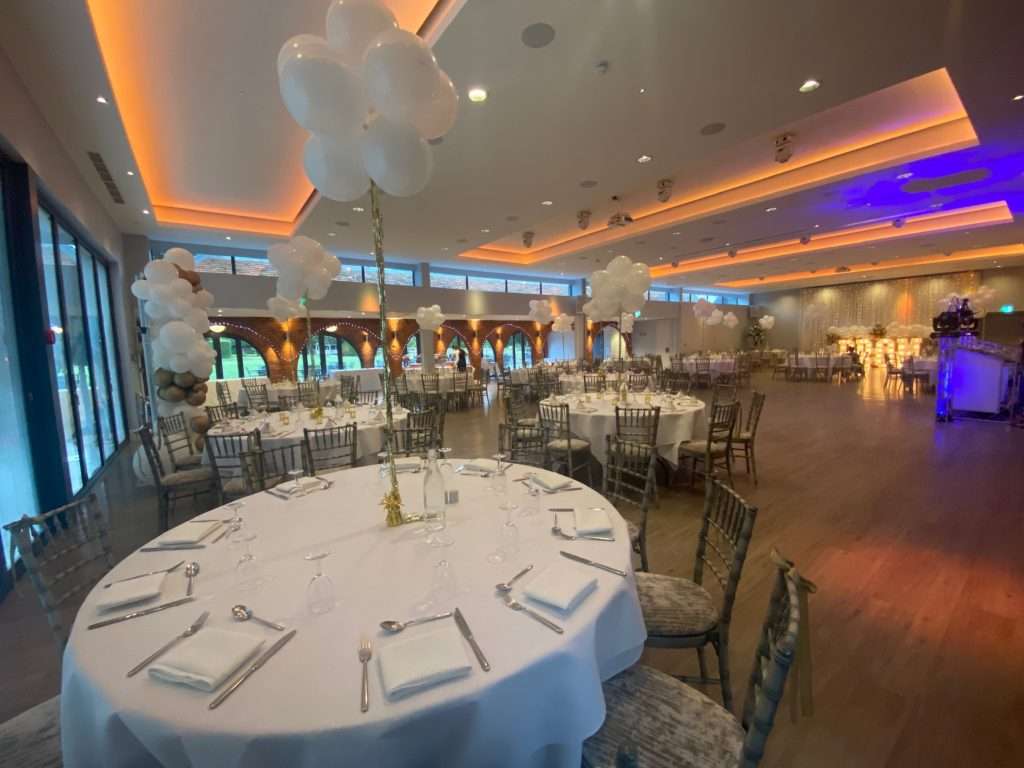 Elegant school prom evening with soft warm lighting and white balloons in the Garden Suite.
