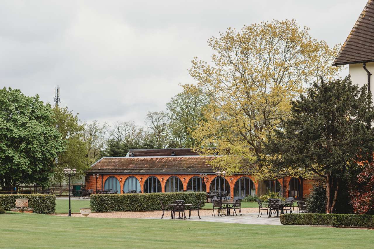 Garden Suite at Greenwoods Hotel with autumnal trees and outdoor seating. Ideal venue for Conferences and Meetings.