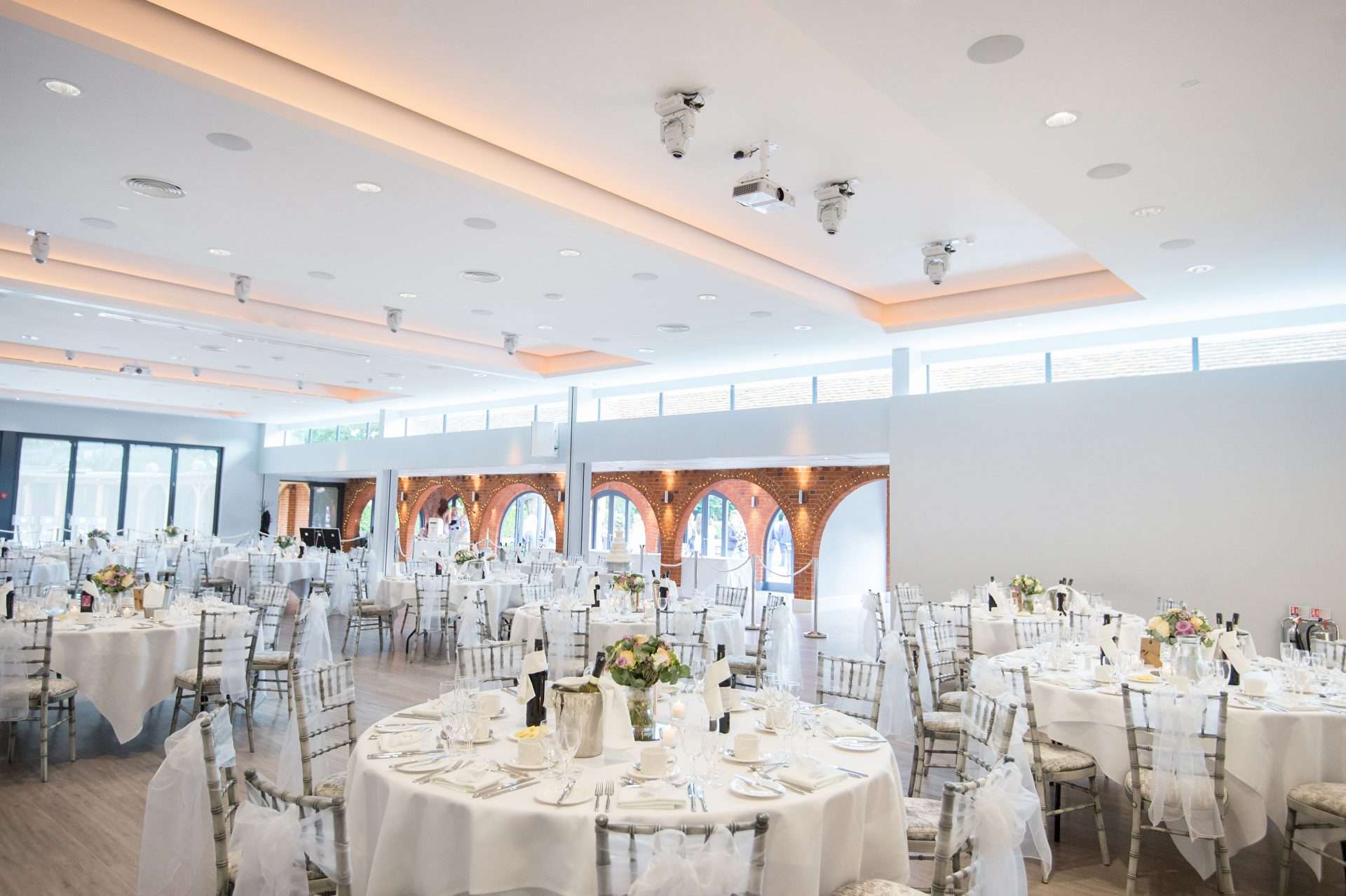 Elegant wedding setup in the Garden Suite at Greenwoods Hotel featuring dressed tables and ambient lighting
