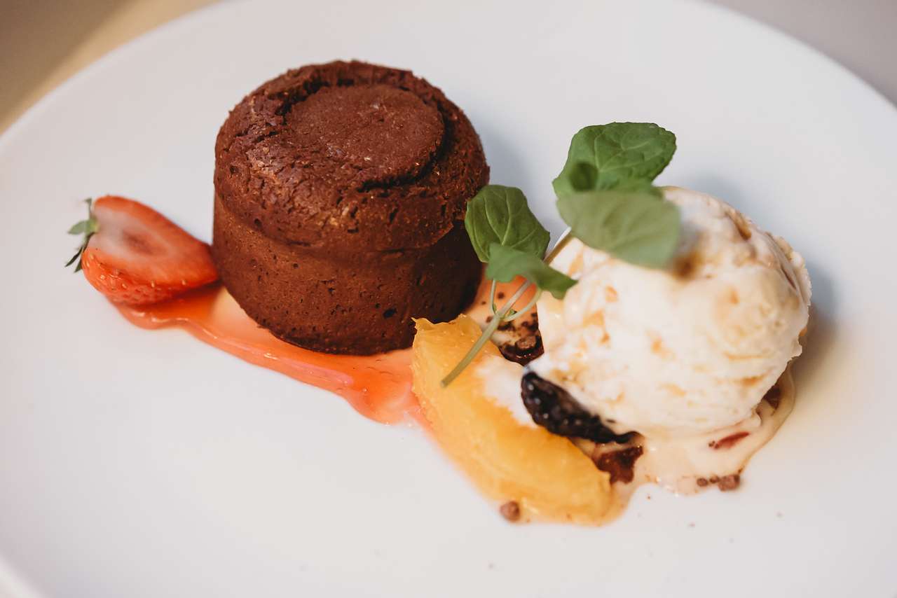 Chocolate dessert with vanilla ice cream and fruit at Greenwoods Restaurant