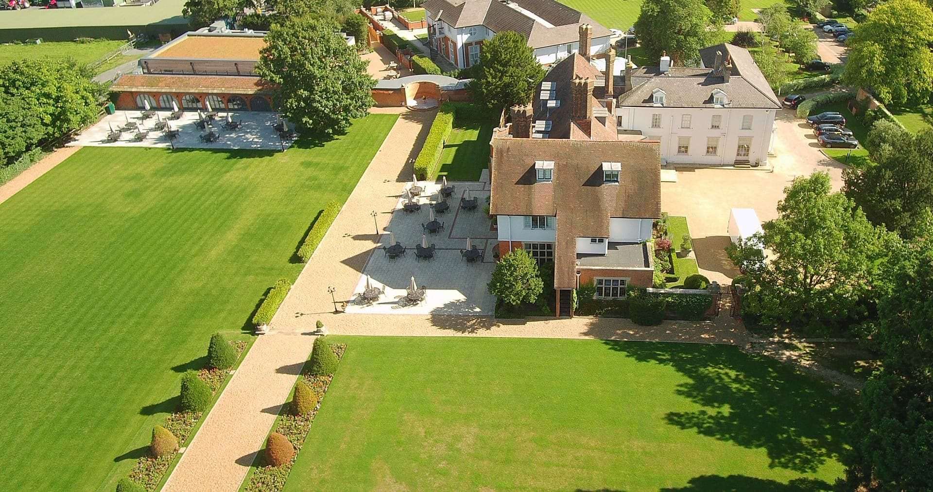 Aerial view showing side of Greenwoods Hotel complex and garden areas