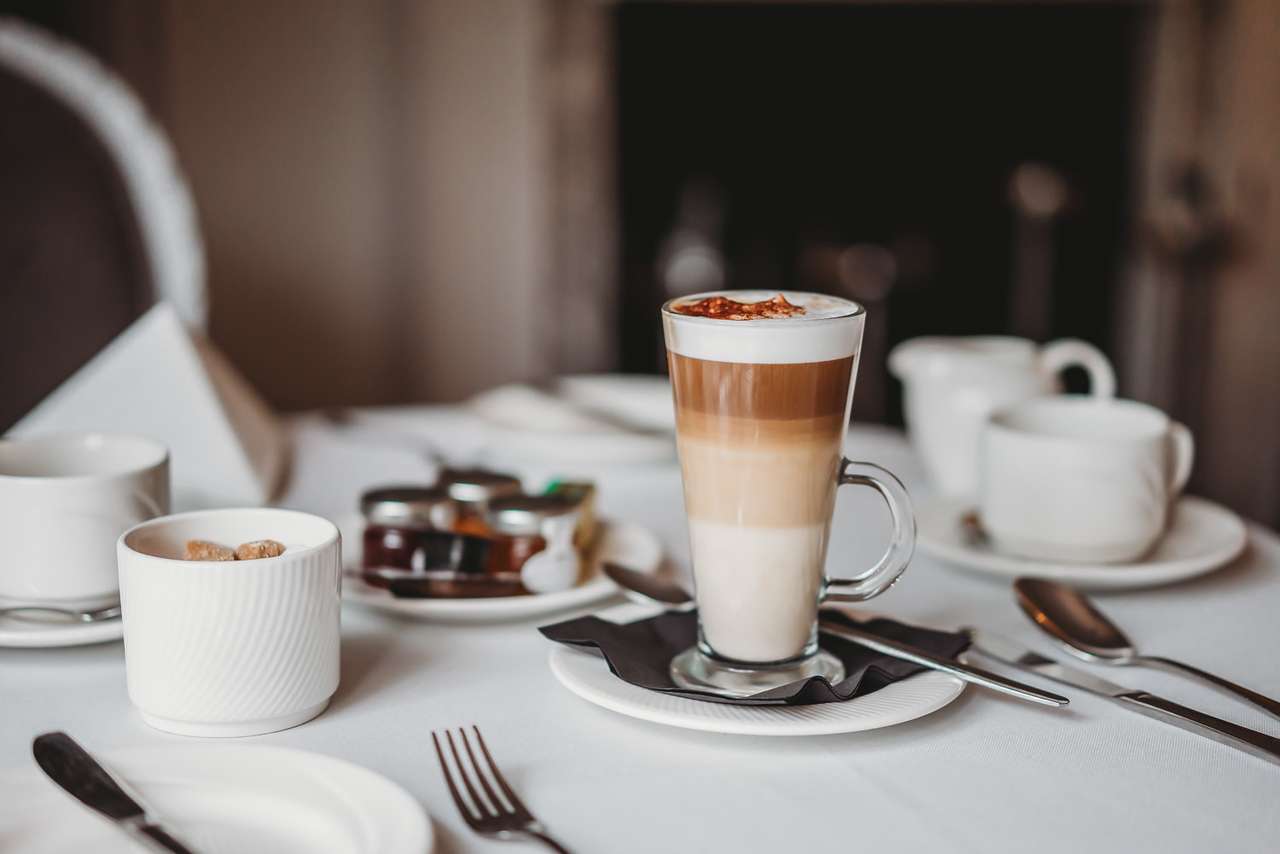 Layered latte coffee served at breakfast table in Greenwoods Restaurant