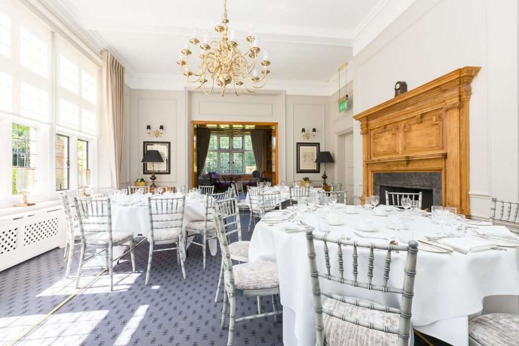 Library Suite setup for a baby or bridal shower at Greenwoods Hotel with three round tables and floral décor.