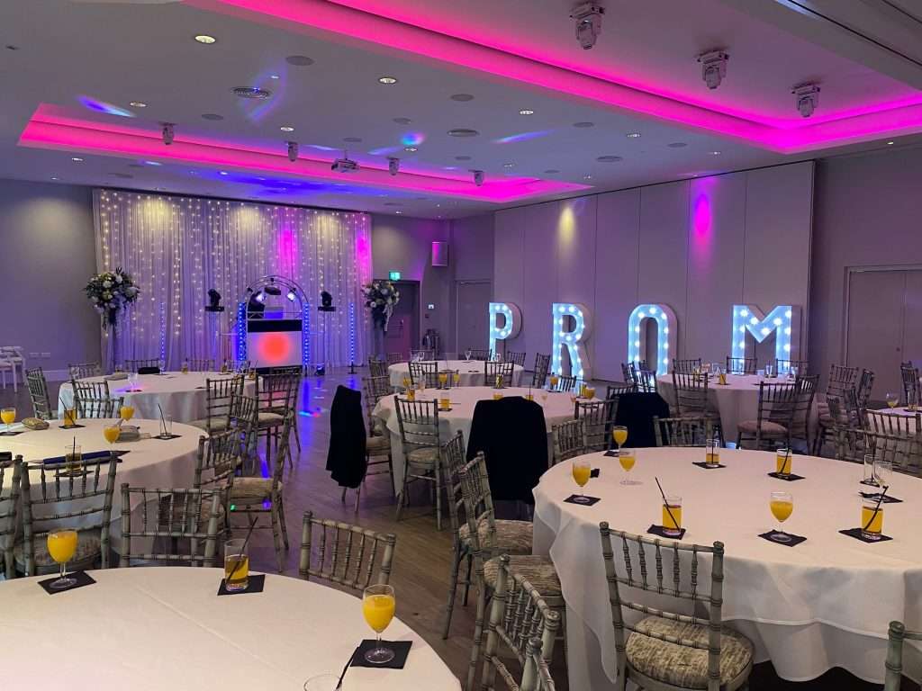 School prom setup in the Garden Suite at Greenwoods Hotel with DJ booth and purple lighting.