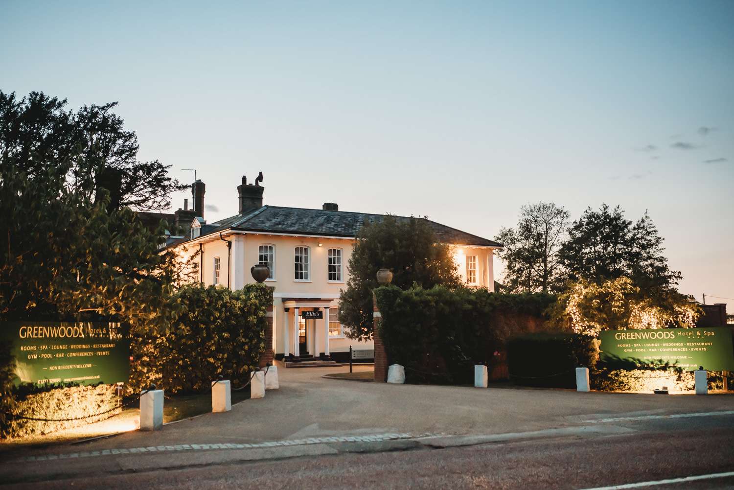 Twilight exterior of Greenwoods Hotel in Essex, showcasing the elegant setting for dry hire weddings, including multicultural and faith-based celebrations, with guests able to stay for a relaxing wedding weekend.