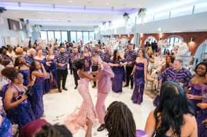 Couple dancing with guests during a lively dry hire wedding reception at Greenwoods Hotel and Spa.