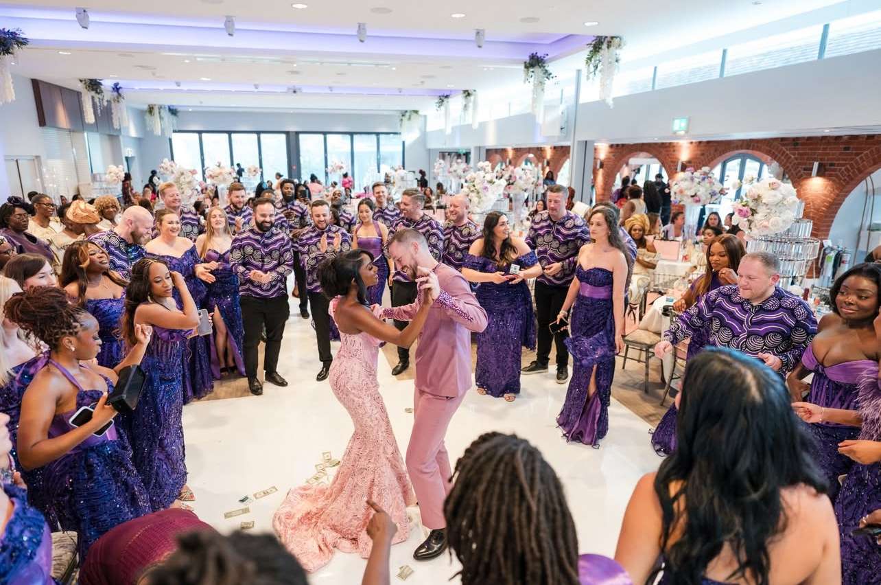 Couple dancing with guests during a lively dry hire wedding reception at Greenwoods Hotel and Spa.