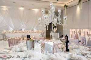 Luxury wedding table setting with crystal candelabra, flowers and reception decor at Greenwoods Hotel and Spa.