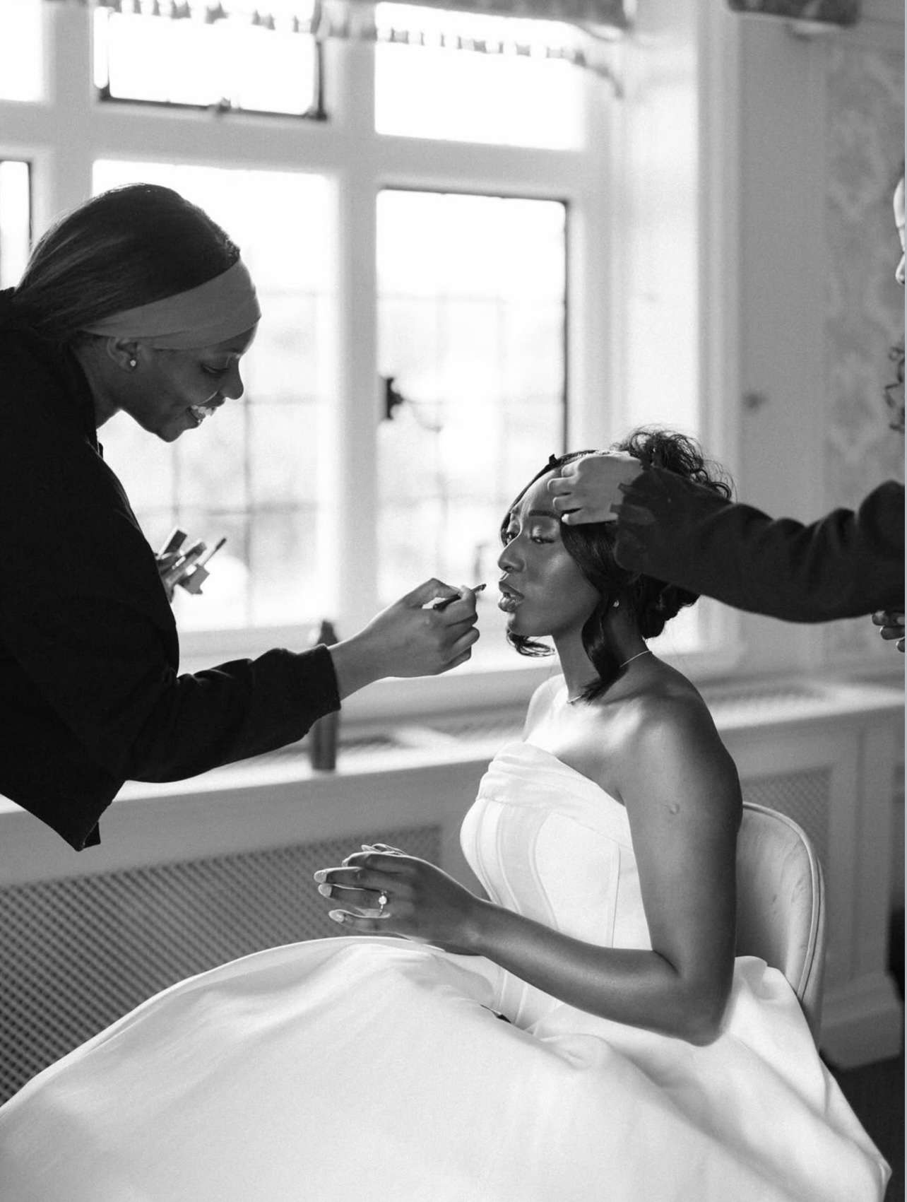 Bride having her makeup applied while getting ready for her wedding at Greenwoods Hotel and Spa.