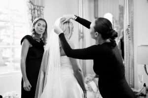 Bride having her veil fitted while getting ready for her wedding at Greenwoods Hotel and Spa.