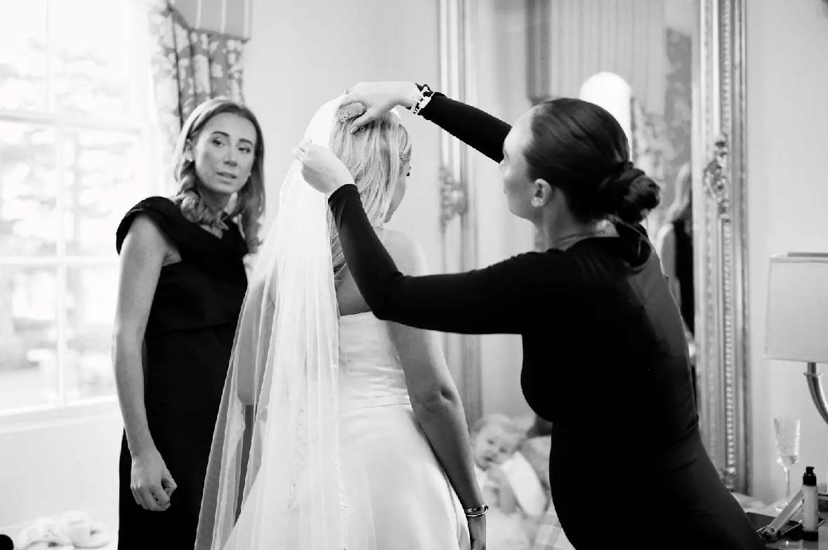 Bride having her veil fitted while getting ready for her wedding at Greenwoods Hotel and Spa.