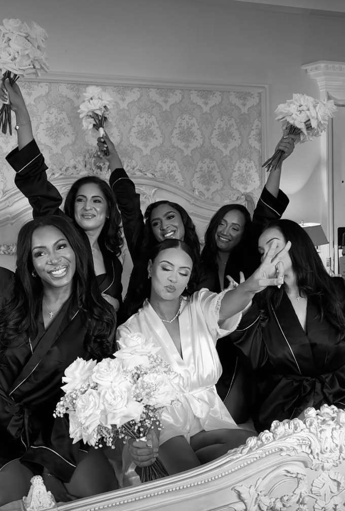 Bride and bridesmaids celebrating together while getting ready for a wedding at Greenwoods Hotel and Spa.