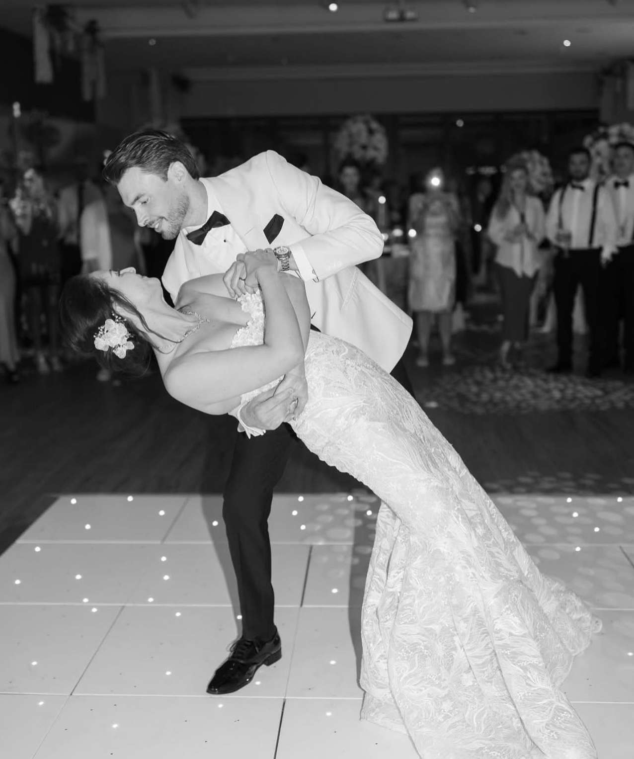 Bride and groom sharing a dramatic first dance moment during their wedding reception at Greenwoods Hotel and Spa.