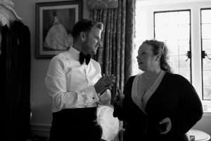 Groom in a bow tie getting ready before a wedding at Greenwoods Hotel and Spa.